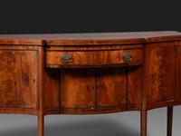 A Federal Fan-Inlaid and Figured Mahogany Serpentine Sideboard