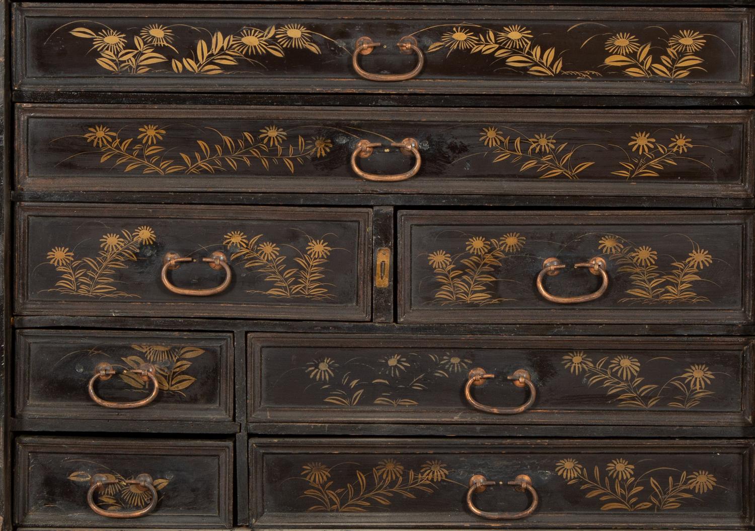 A Chinese Black and Gilt Lacquered Cabinet on Stand