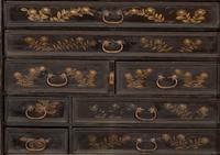 A Chinese Black and Gilt Lacquered Cabinet on Stand