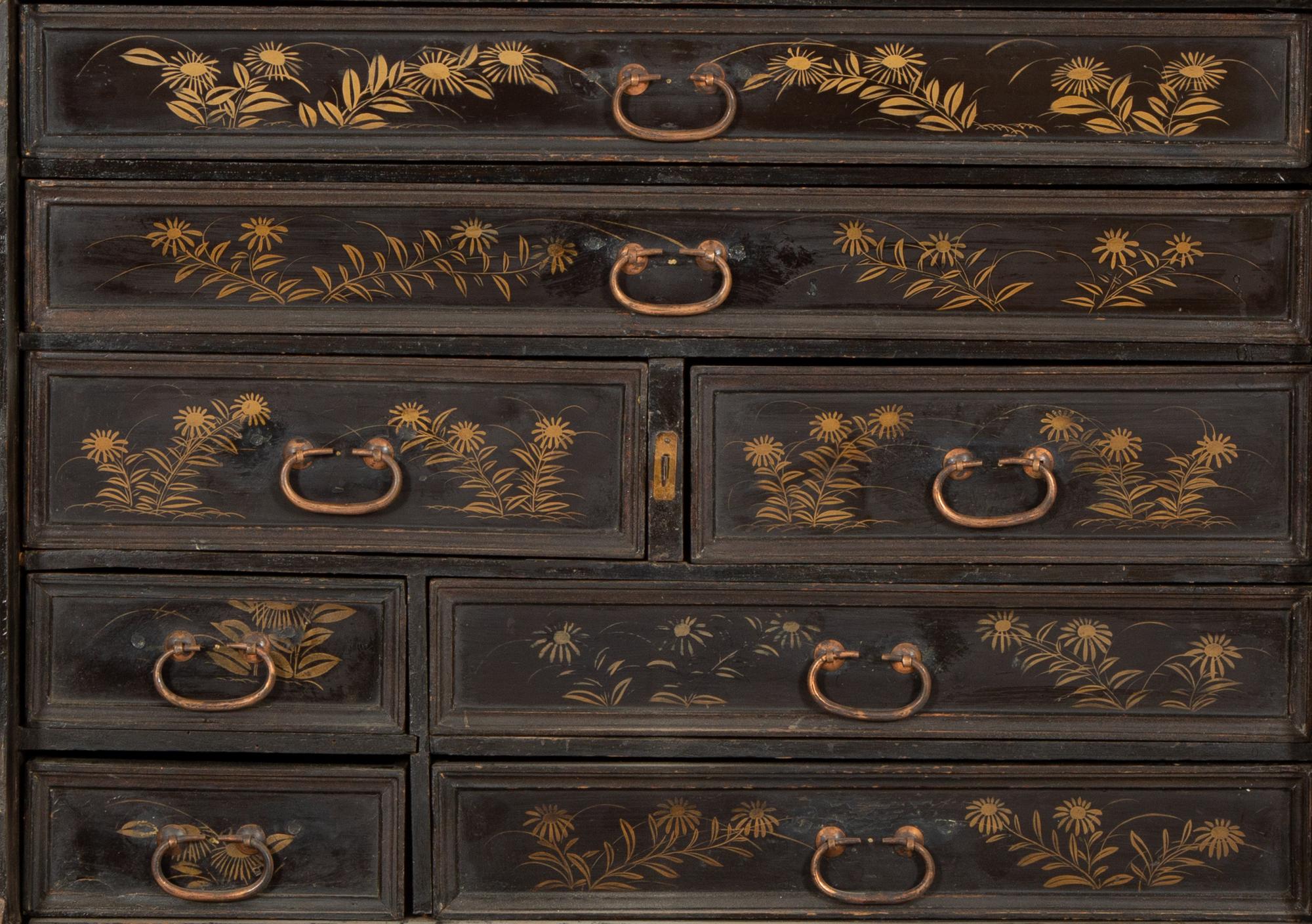 A Chinese Black and Gilt Lacquered Cabinet on Stand