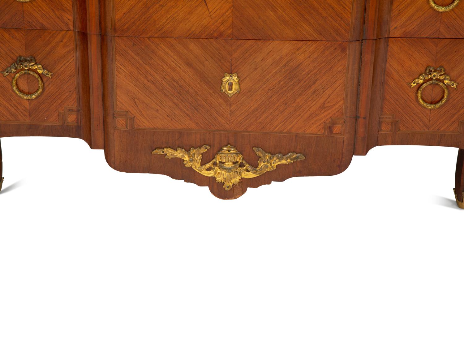 A French Gilt Metal Mounted Mahogany and Kingwood Marquetry Marble-Top Commode