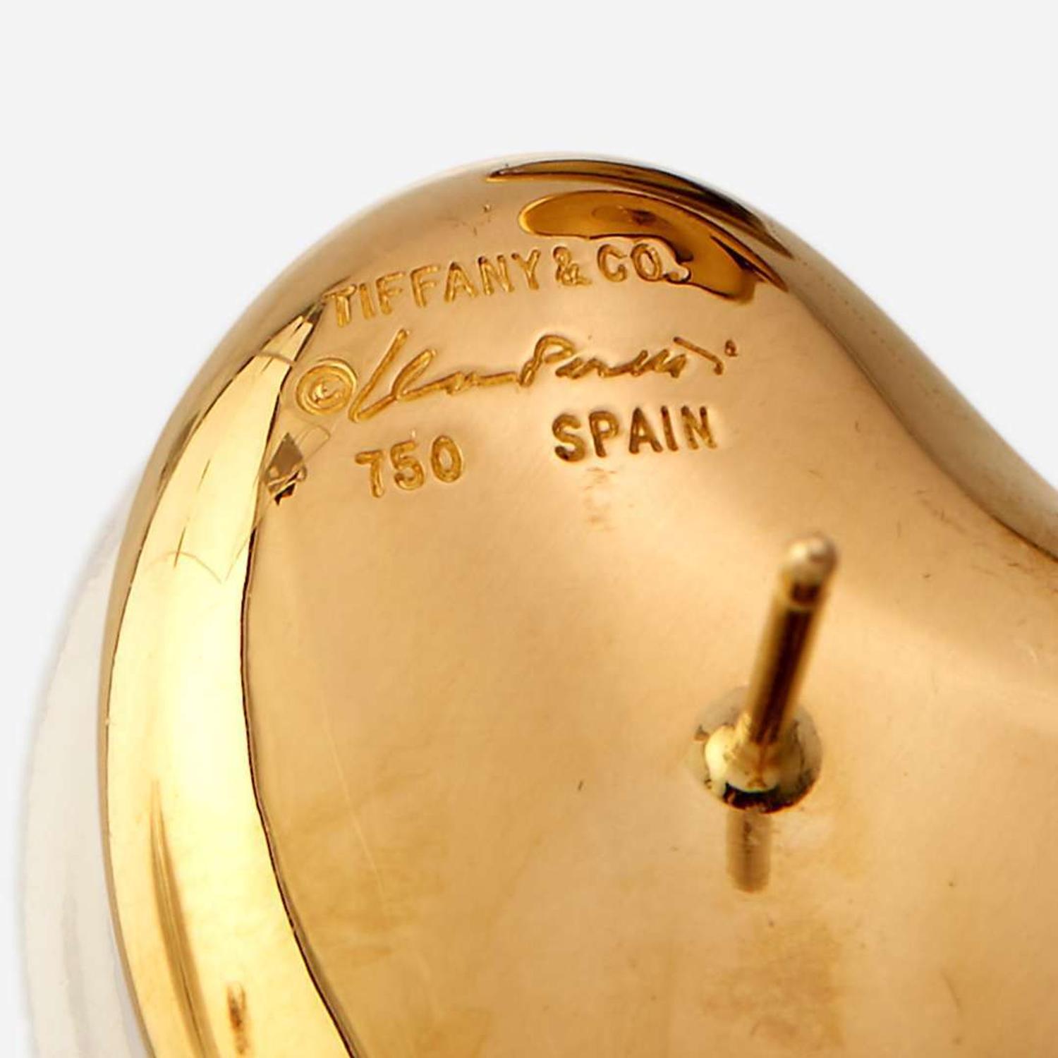 A pair of eighteen karat gold earrings, together with two diamond and eighteen karat gold rings, Tiffany & Co. Elsa Peretti, Spain