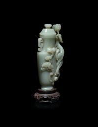 A Finely Carved Chinese Celadon Jade 'Chilong' Covered Vase