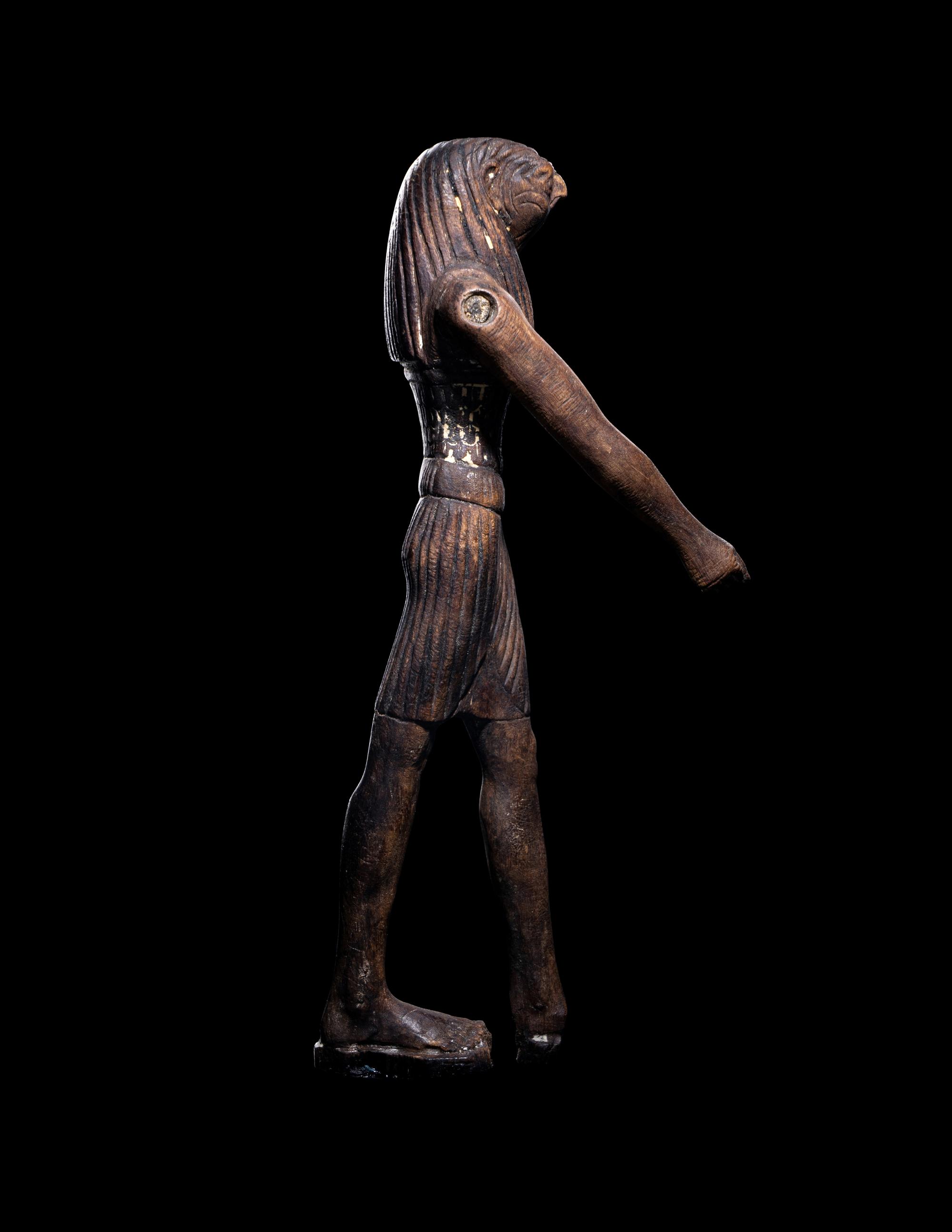 An Egyptian Wood Striding Montu