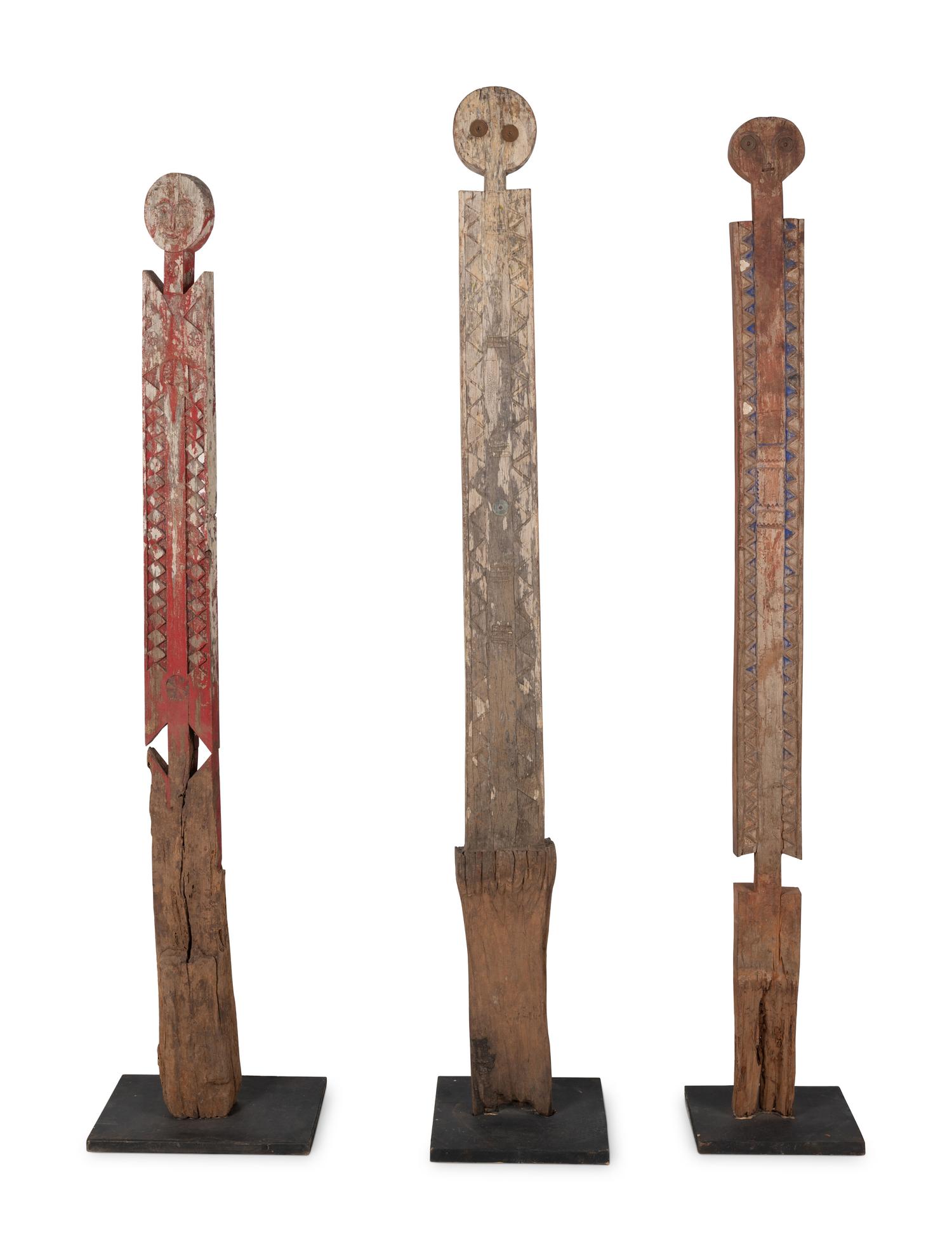 A Group of Three Carved Commemorative Posts
