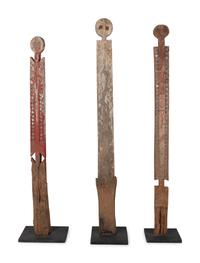 A Group of Three Carved Commemorative Posts