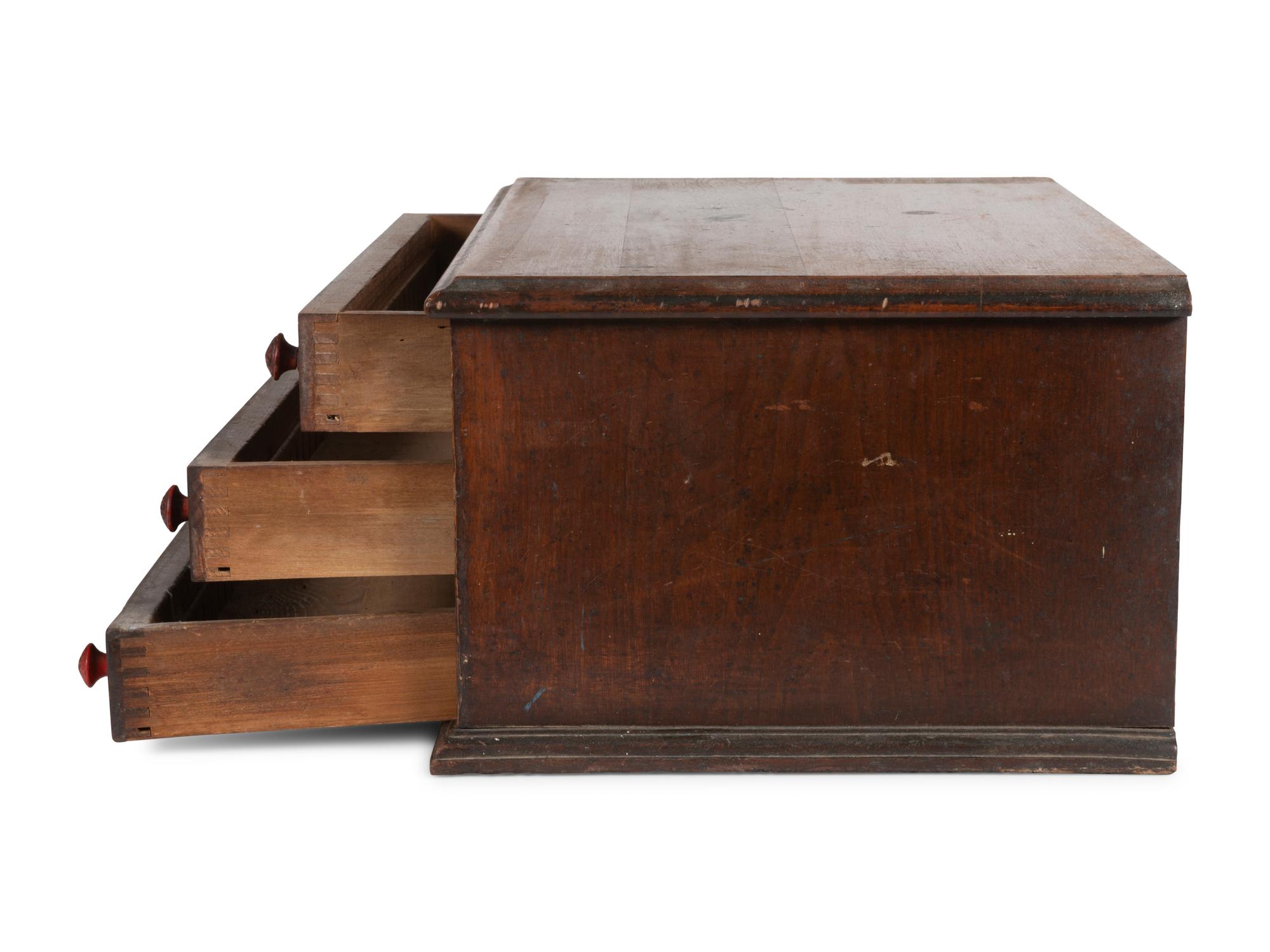 A Thomas Russell Painted Wood Spool Cabinet