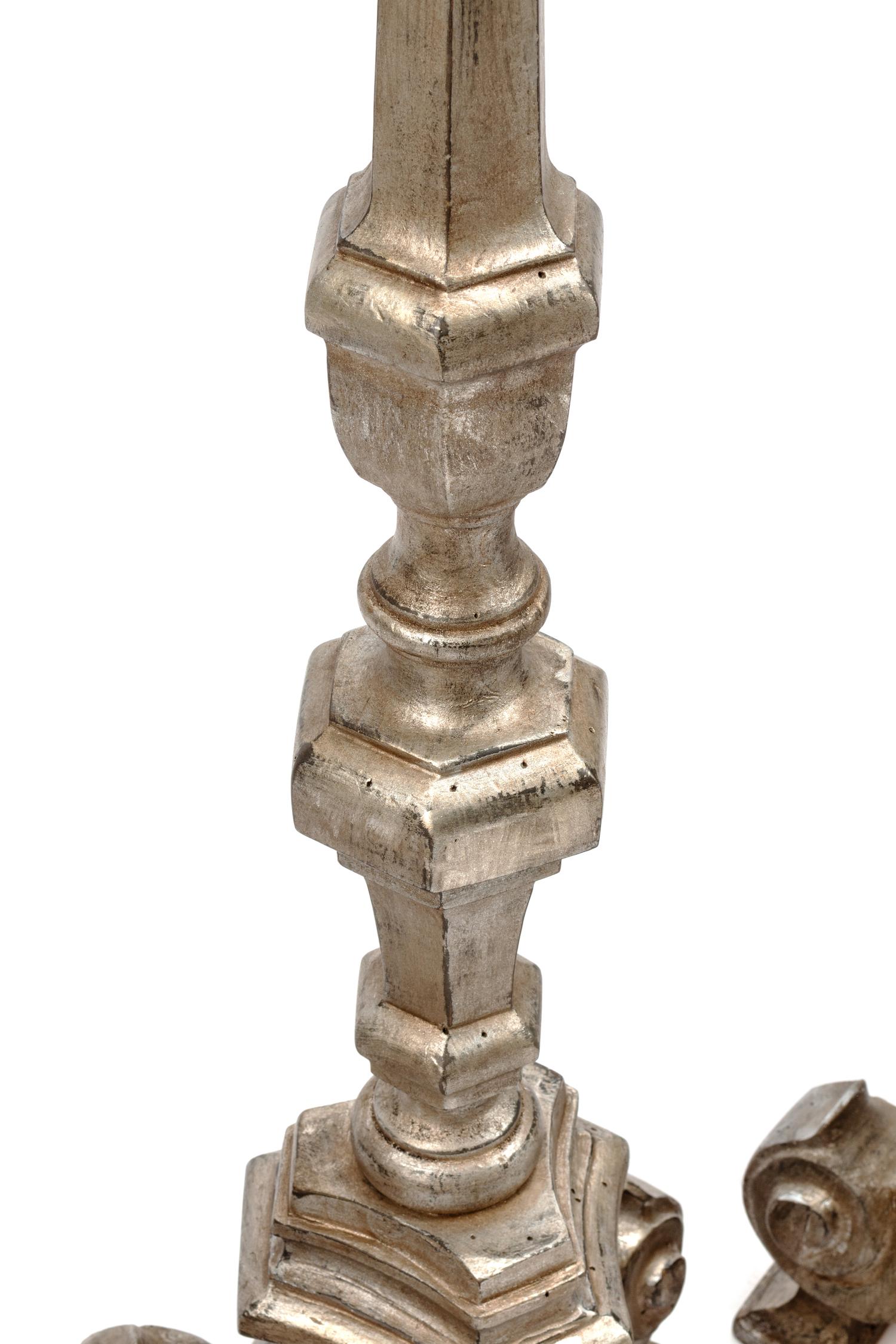 A Set of Four Northern European Gilt and Silvered Wood Candlesticks