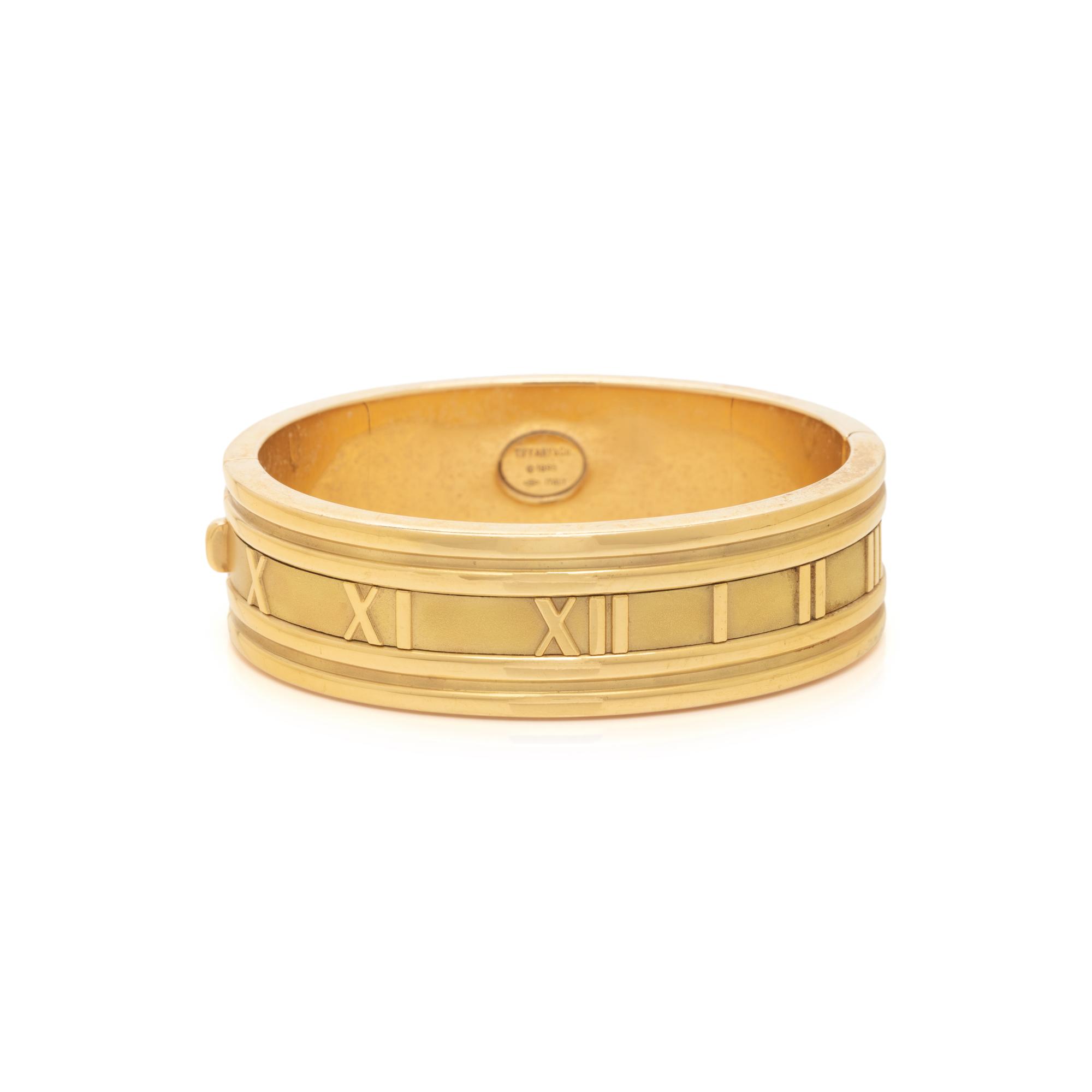 TIFFANY & CO., YELLOW GOLD 'ATLAS' BANGLE BRACELET