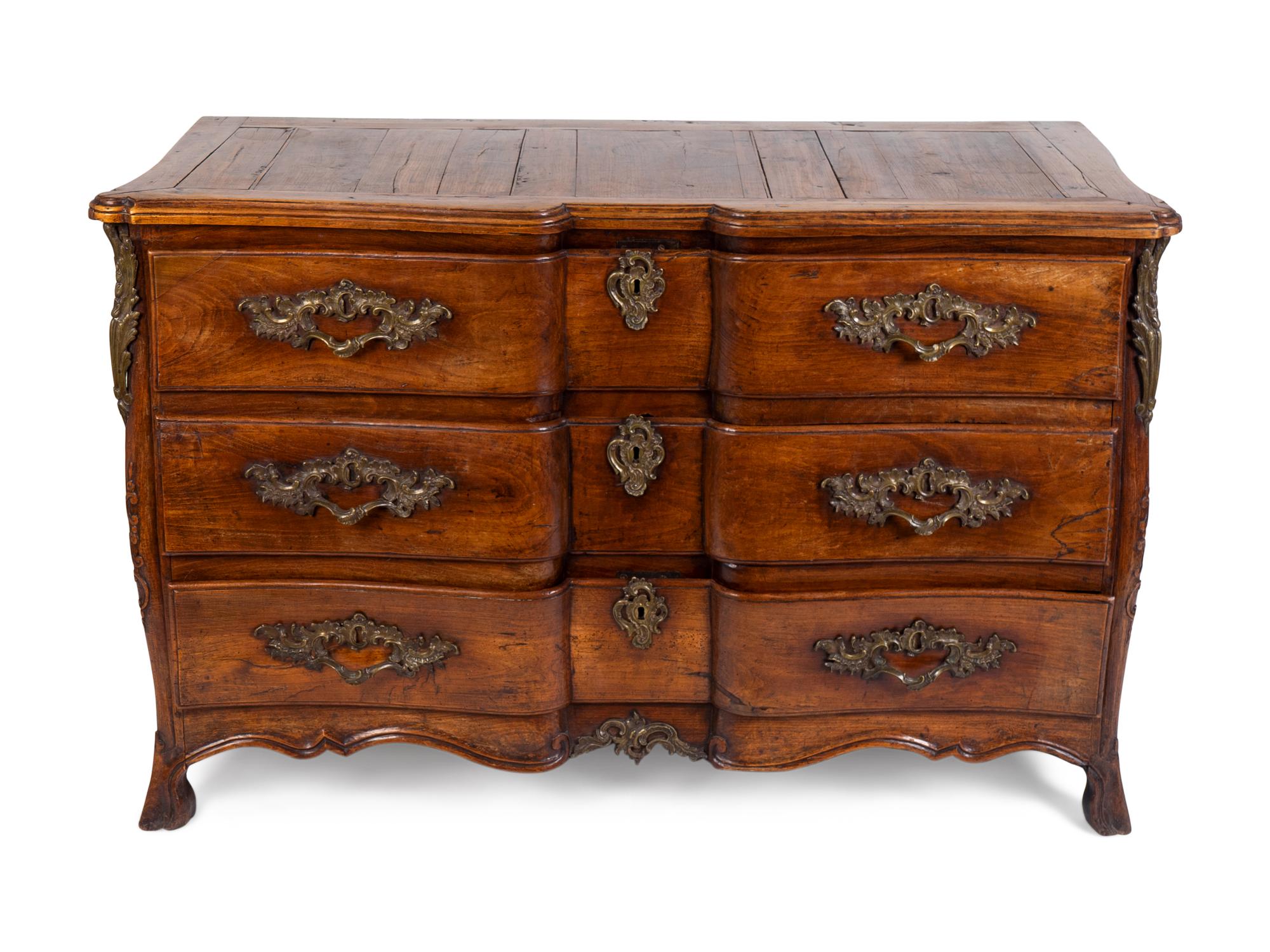 A Louis XV Provincial Walnut Commode — THIRD QUARTER 18TH CENTURY