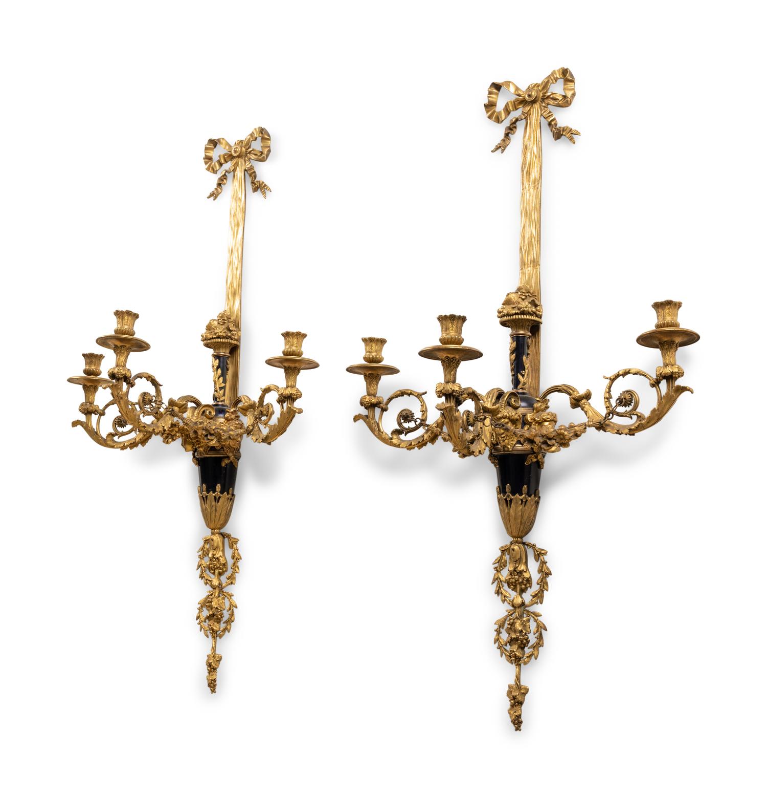 A Pair of Louis XVI Style Gilt Bronze Three-Light Wall Sconces