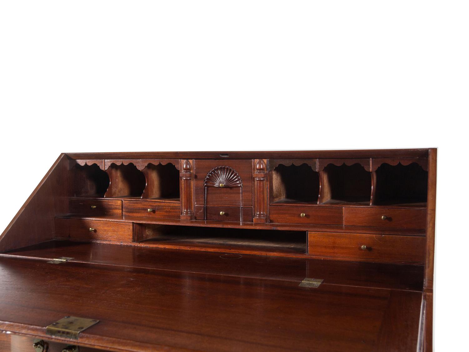 A Chippendale Carved Mahogany Reverse Serpentine Block-Front Desk