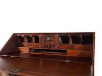 A Chippendale Carved Mahogany Reverse Serpentine Block-Front Desk
