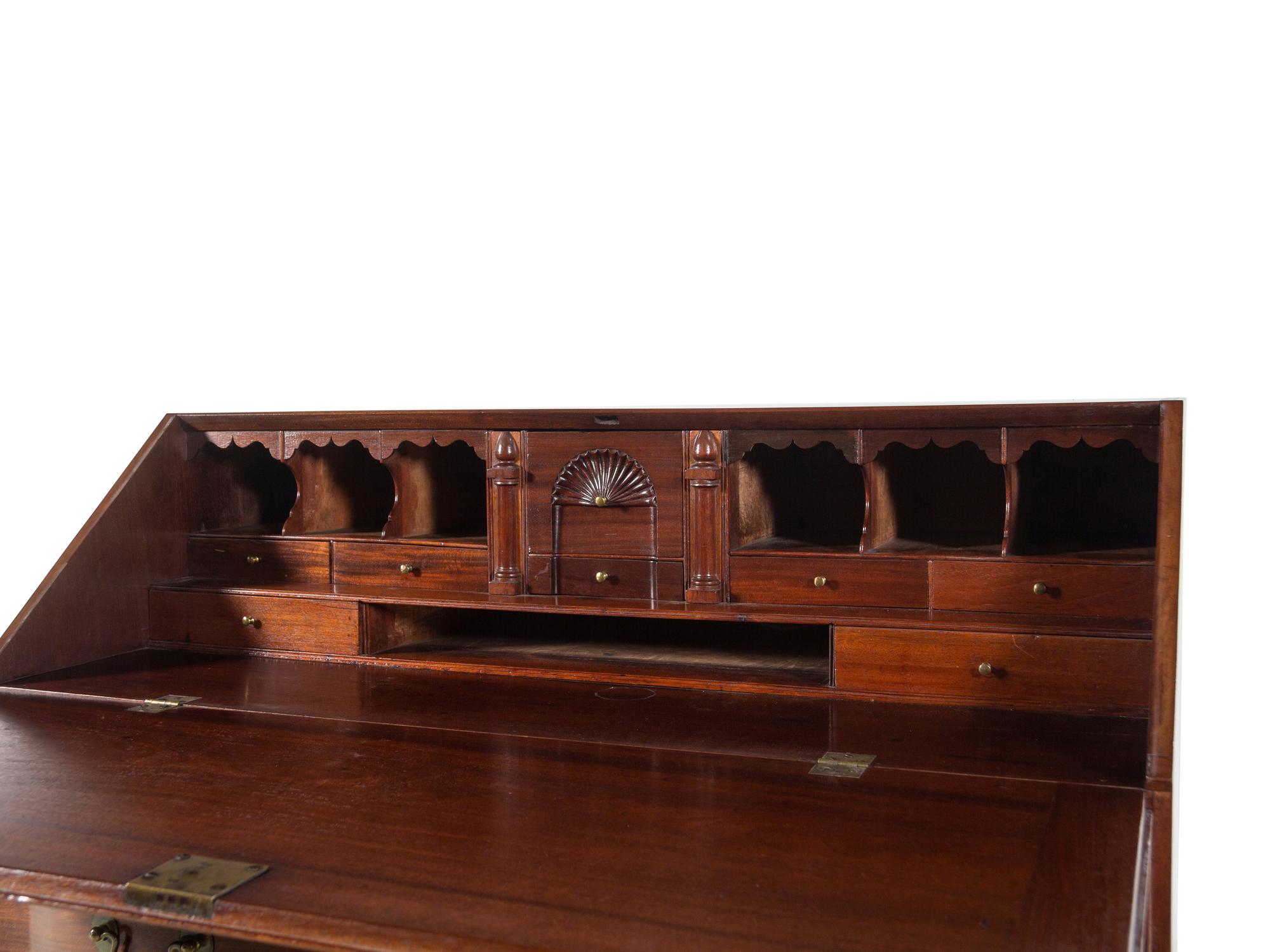 A Chippendale Carved Mahogany Reverse Serpentine Block-Front Desk