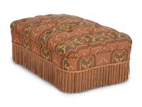 An Upholstered Button Tufted Ottoman with Skirt