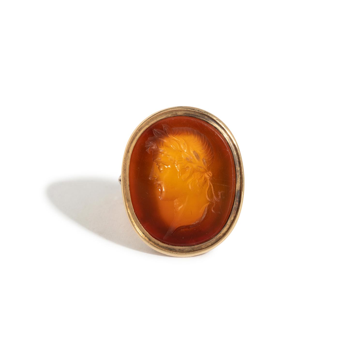 A Neoclassical Gold and Carnelian Finger Ring with a Male Portrait Head