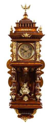 A German Gilt Metal Mounted Wall Clock Height 47 inches.