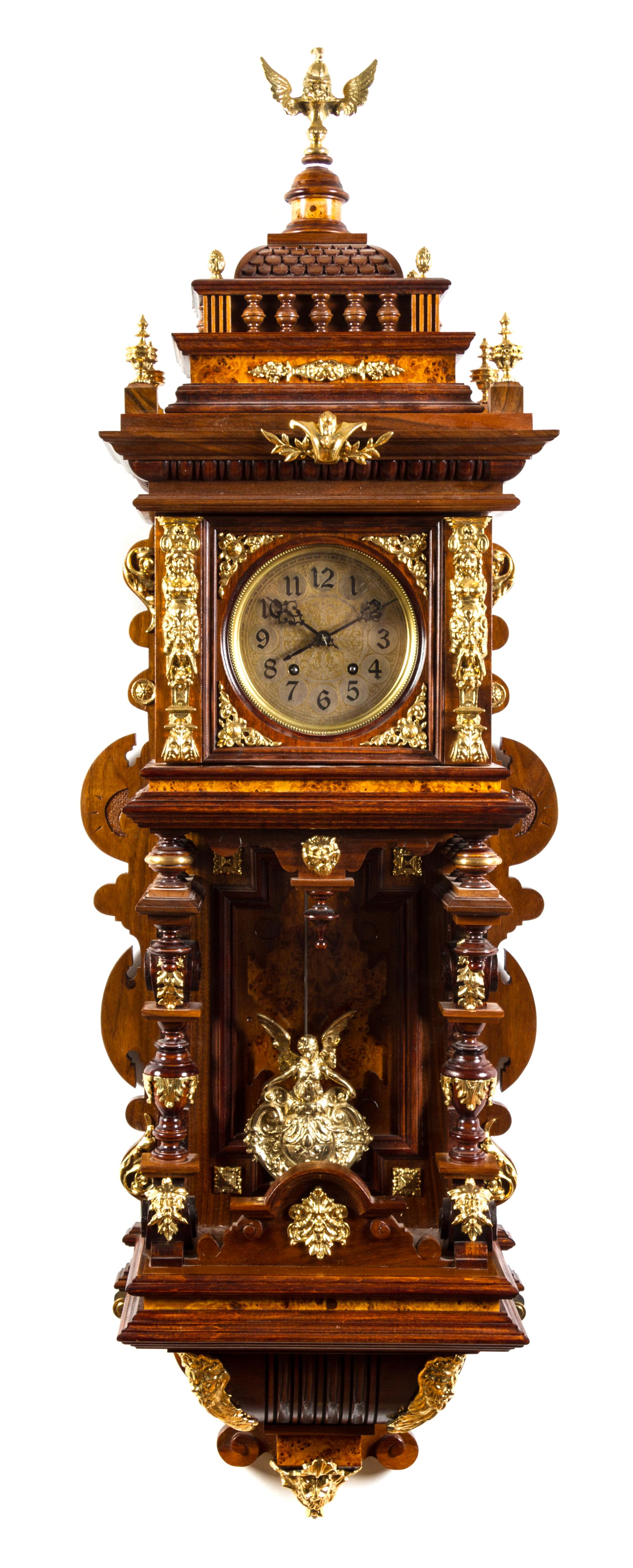 A German Gilt Metal Mounted Wall Clock Height 47 inches.