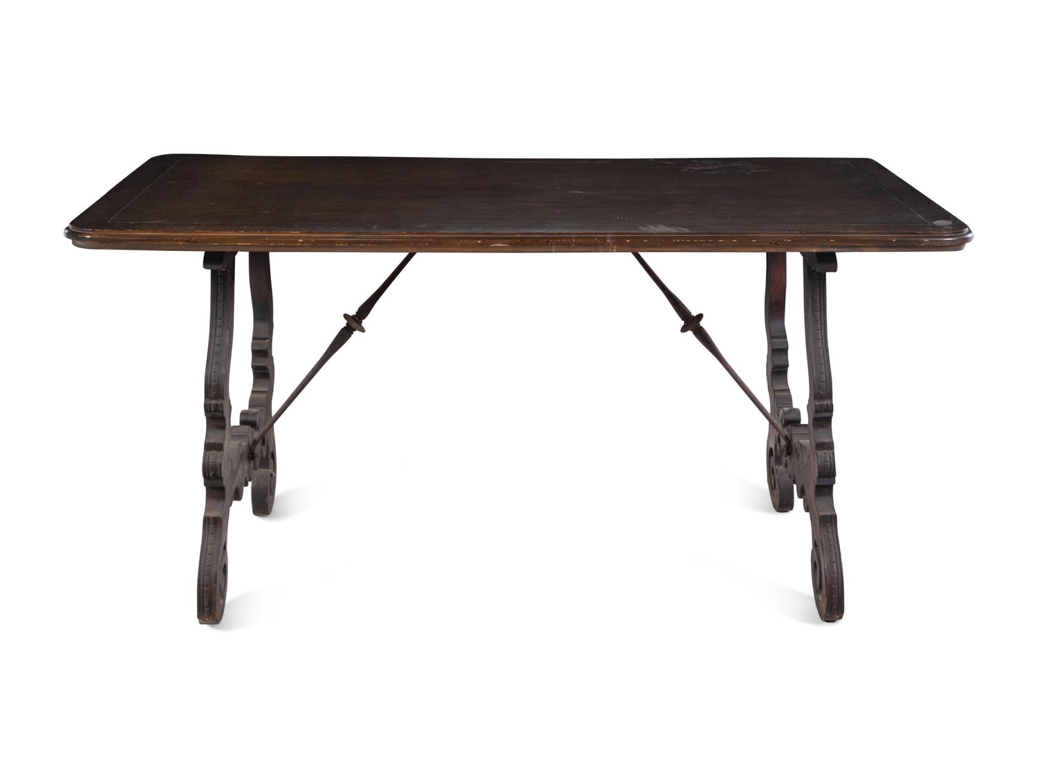 A Spanish Baroque Style Iron Mounted Walnut Trestle Table