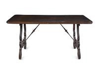 A Spanish Baroque Style Iron Mounted Walnut Trestle Table