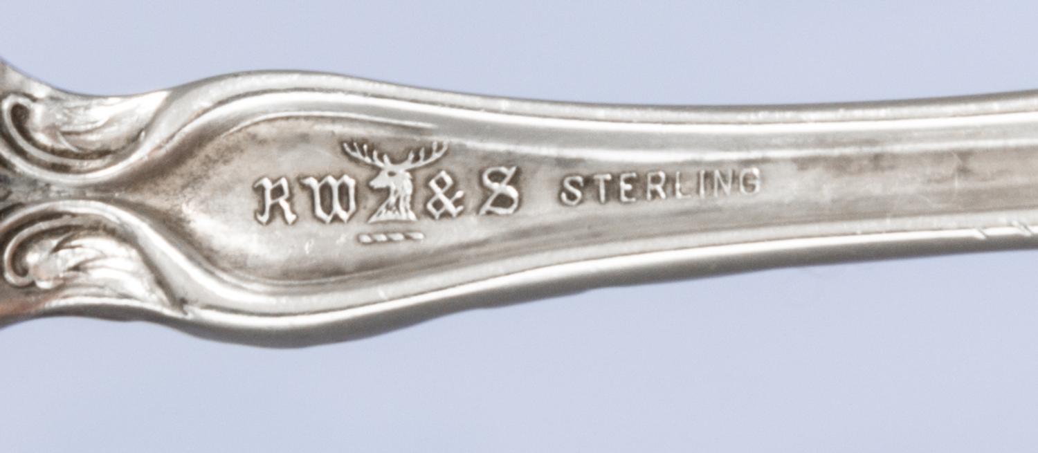 An American Art Nouveau Silver Serving Spoon, R. Wallace & Sons Mfg. Co., Wallingford, CT, monogrammed GFS on the underside.