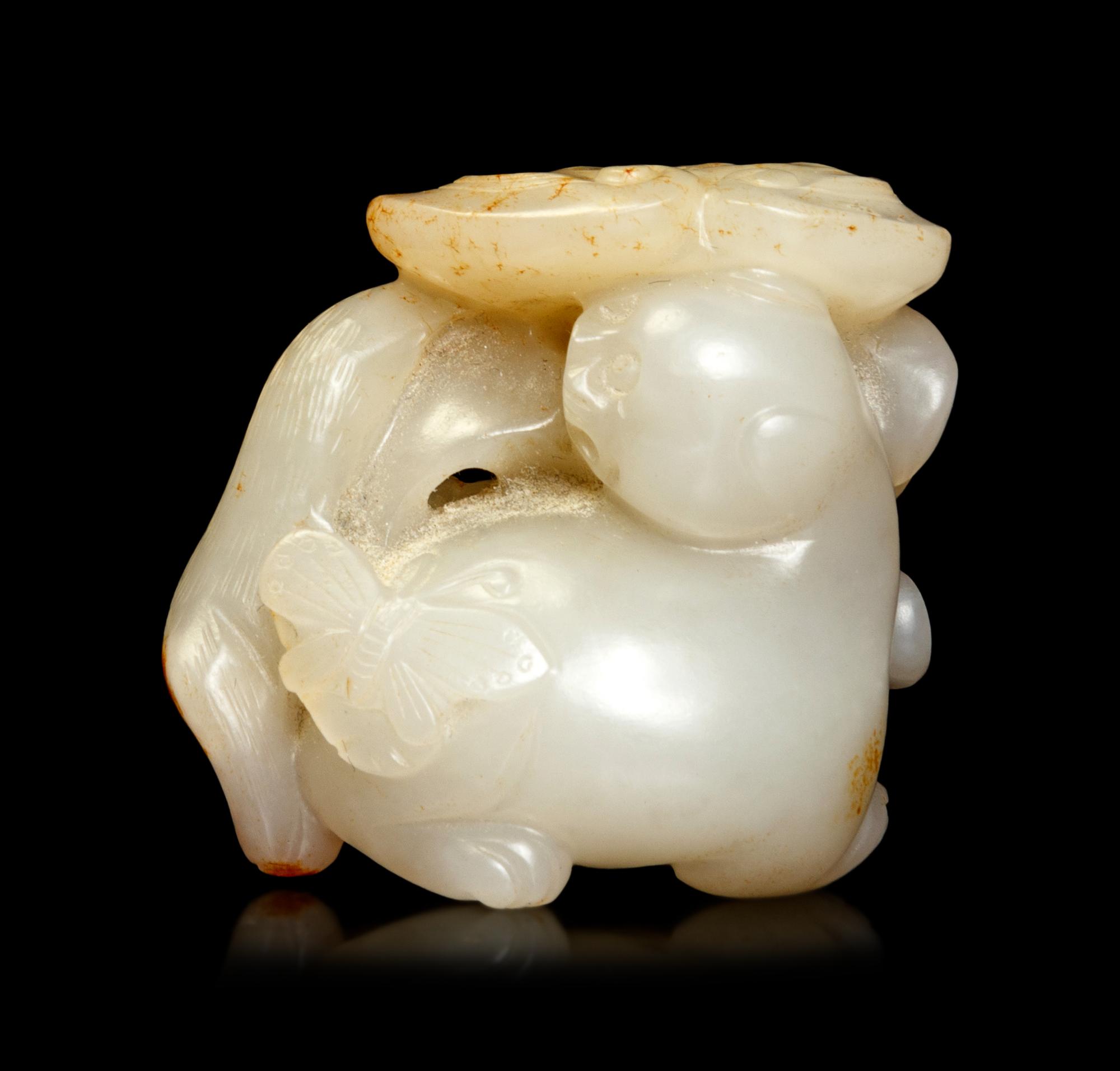 A White Jade 'Cat and Butterfly' Carving
