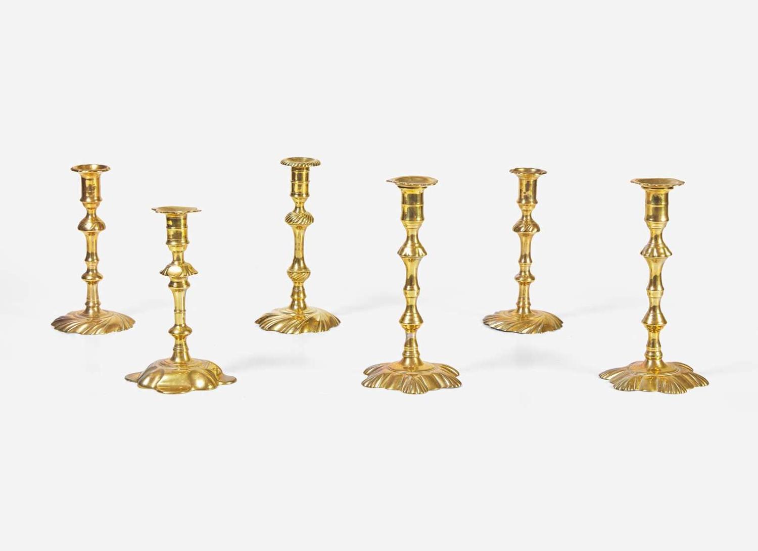 A group of six English brass candlesticks, 18th century