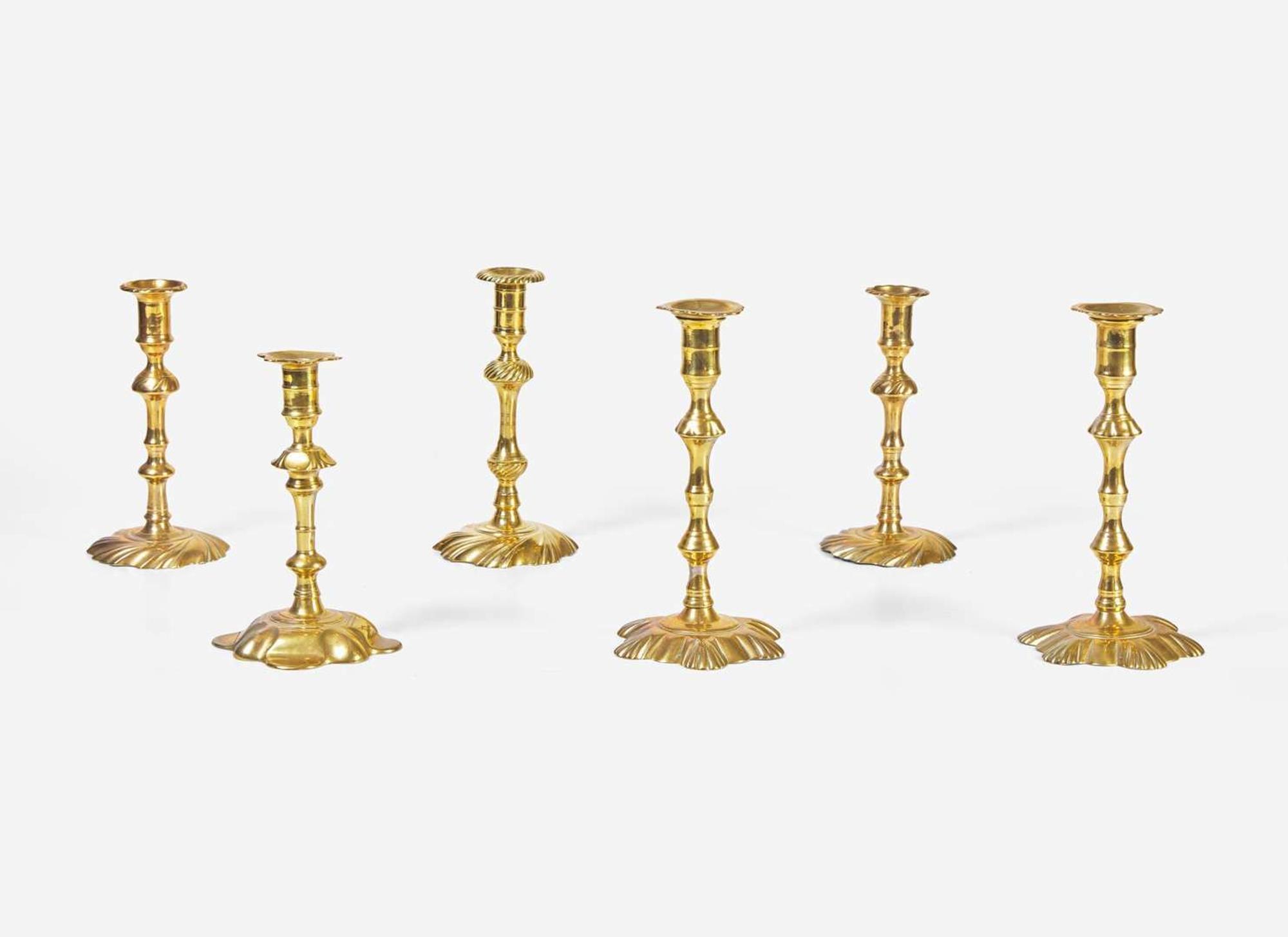 A group of six English brass candlesticks, 18th century