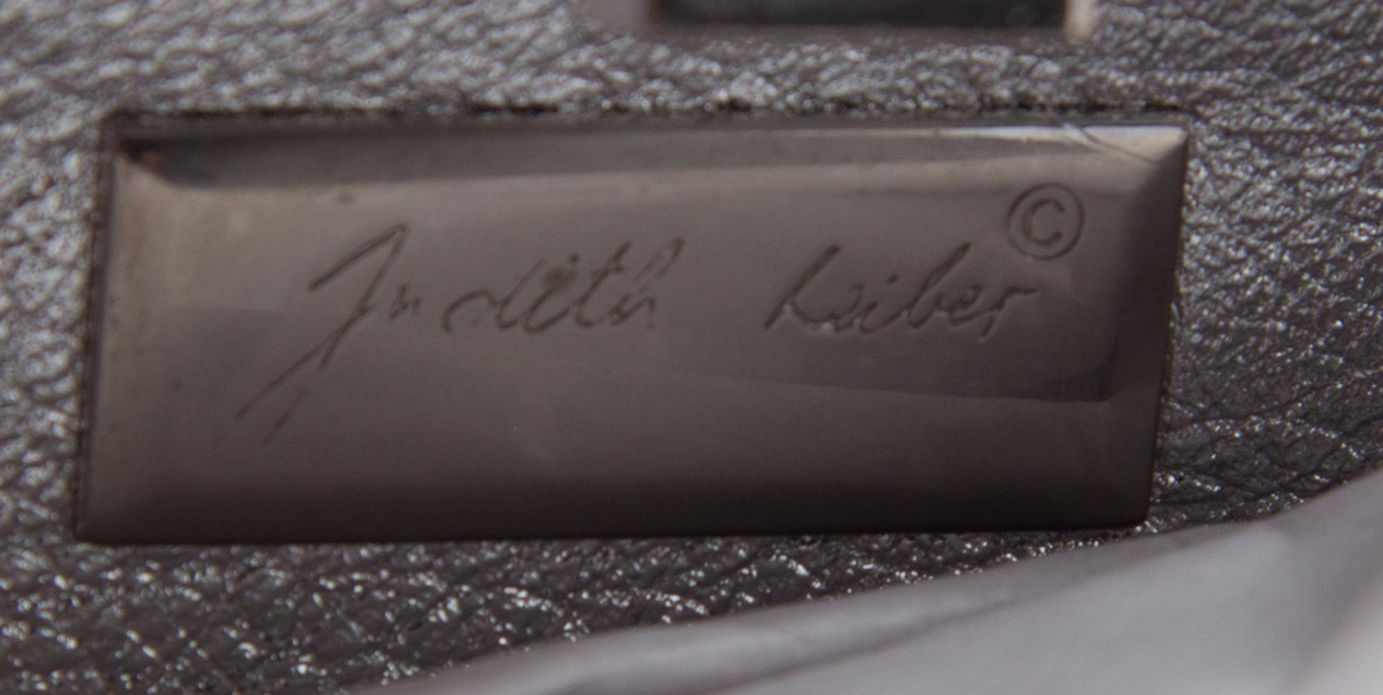 A Judith Leiber Silver Minaudiere Clutch, 6.5" x 3.5" x 2".