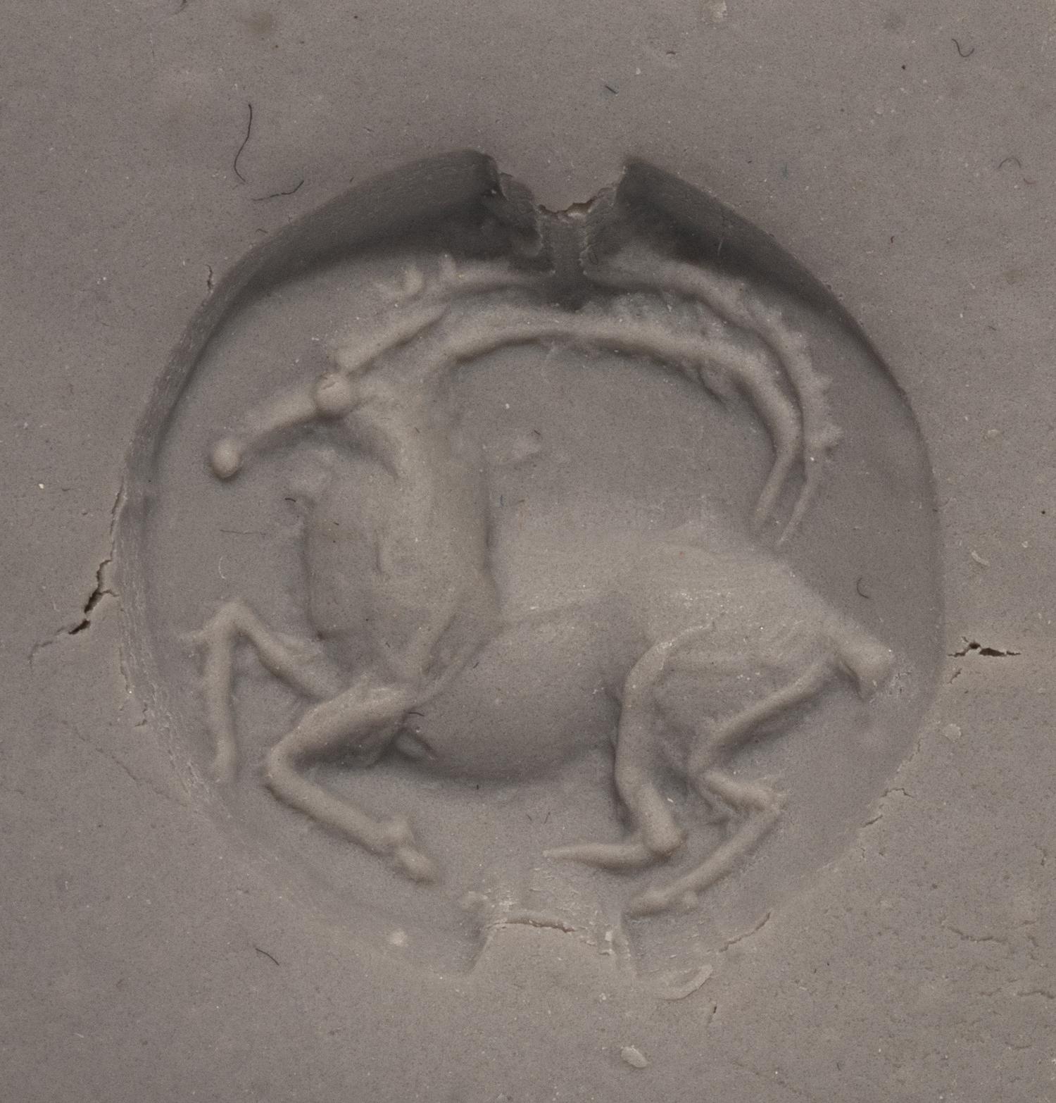 A Minoan Black Steatite Lentoid with a Goat