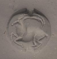 A Minoan Black Steatite Lentoid with a Goat