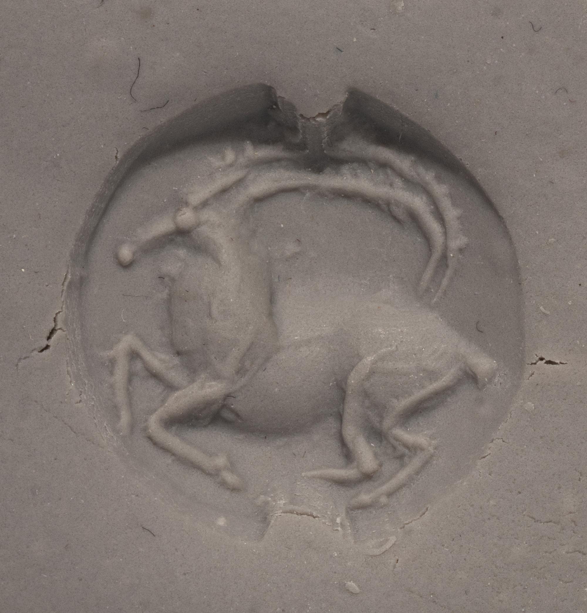 A Minoan Black Steatite Lentoid with a Goat