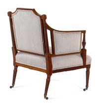 A Regency Style Carved and Inlaid Mahogany Armchair