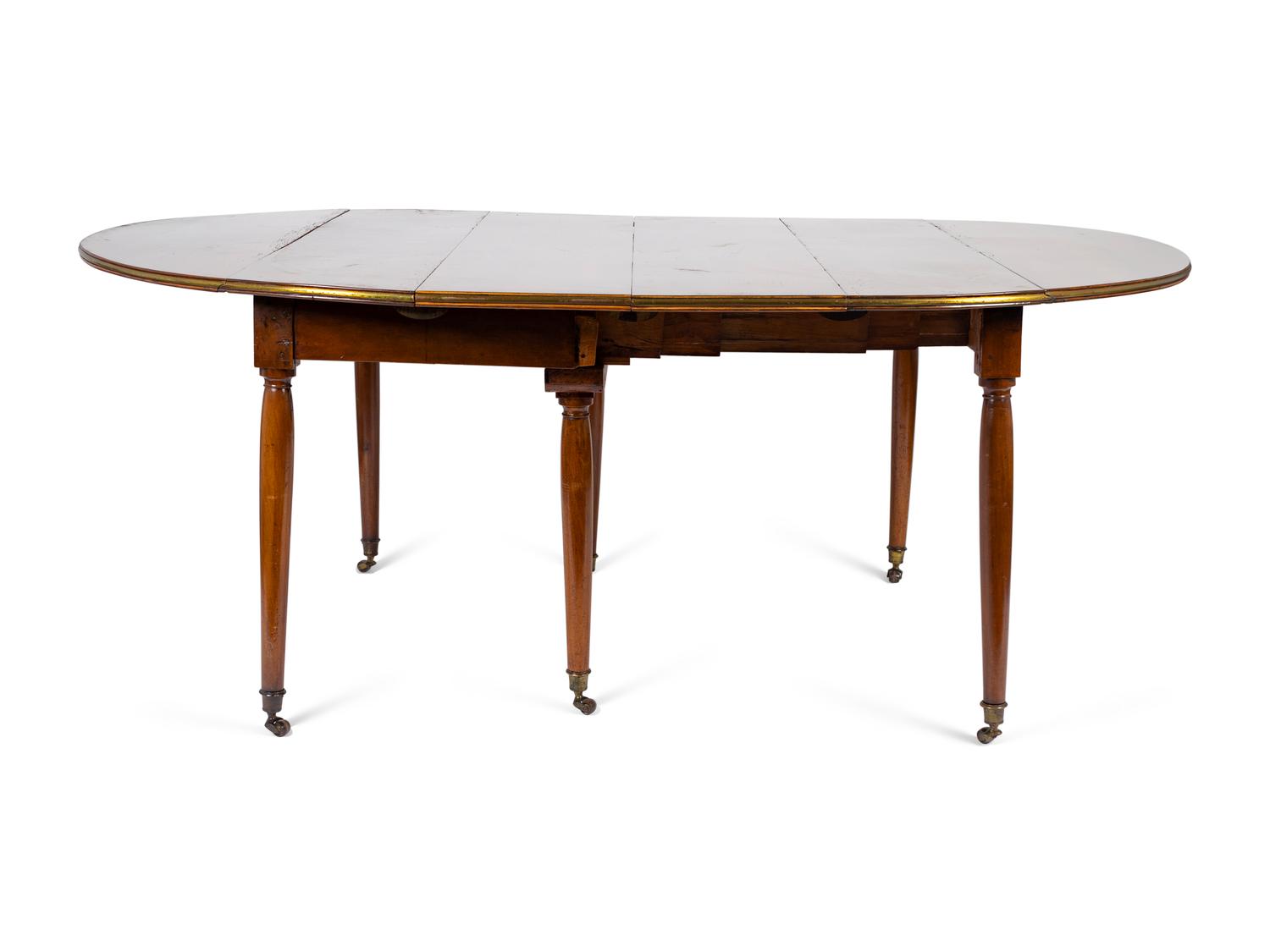 A Louis XVI Mahogany and Brass Banded Extension Dining Table — CIRCA 1790
