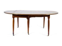 A Louis XVI Mahogany and Brass Banded Extension Dining Table — CIRCA 1790