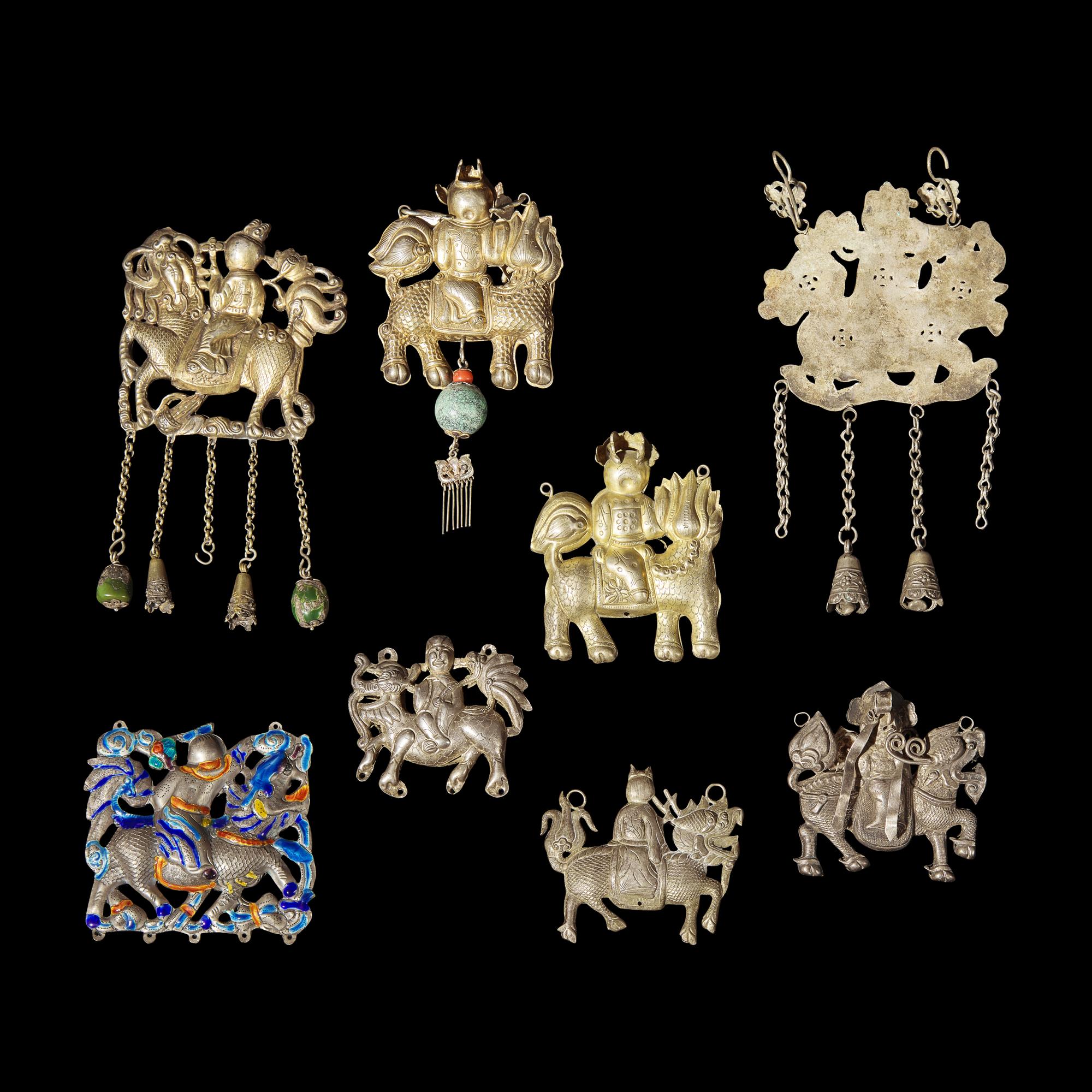 Eight Chinese Silver 'Boy and Qilin' Pendants, Late Qing Dynasty-Republic Period 晚清-民國 銀鍍金、銀燒藍及銀製麒麟送子長命鎖一組八件