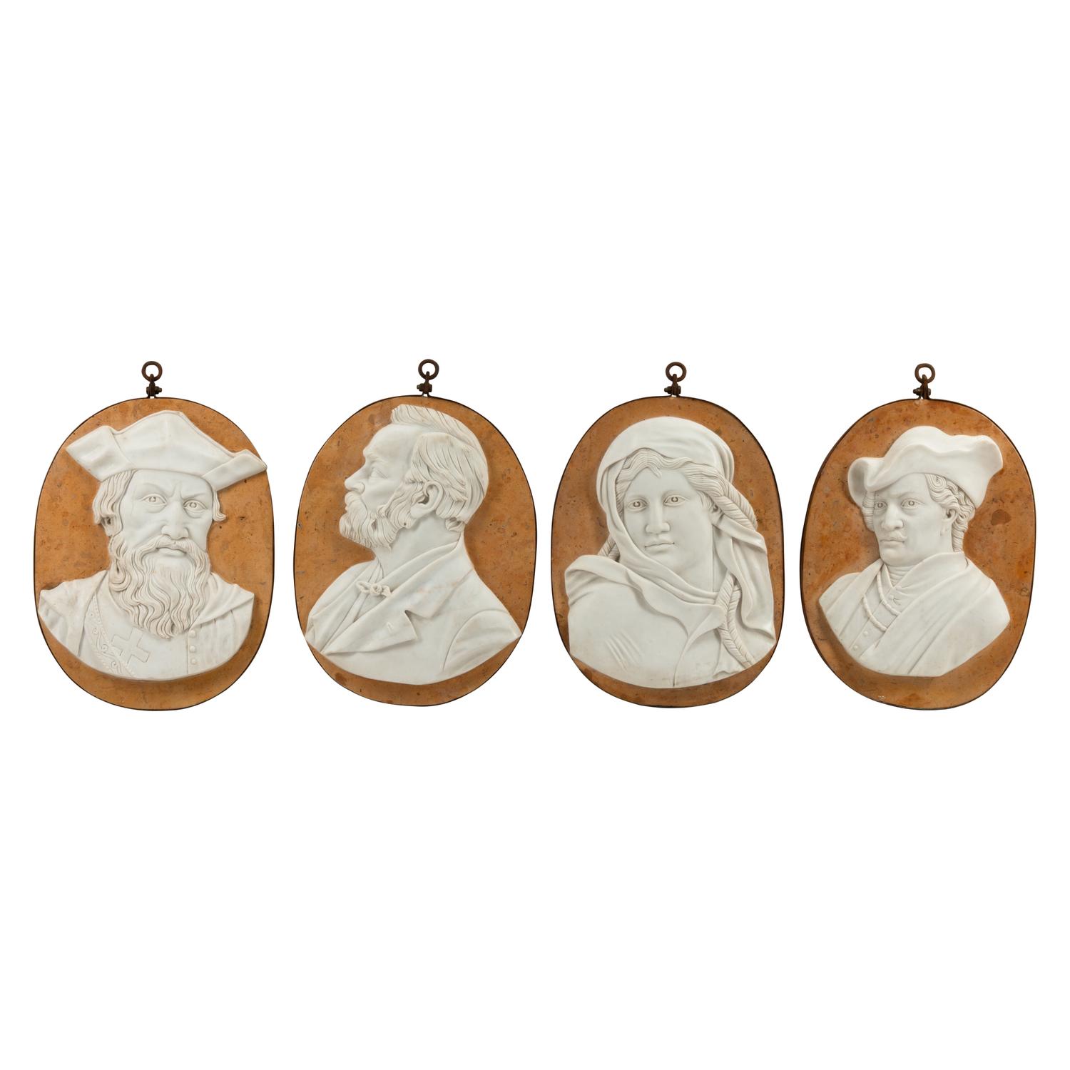 A Set of Four Iron-Mounted Marble Profile Plaques