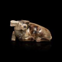 A Chinese partially calcified greyish-beige jade buffalo 灰白玉水牛擺件