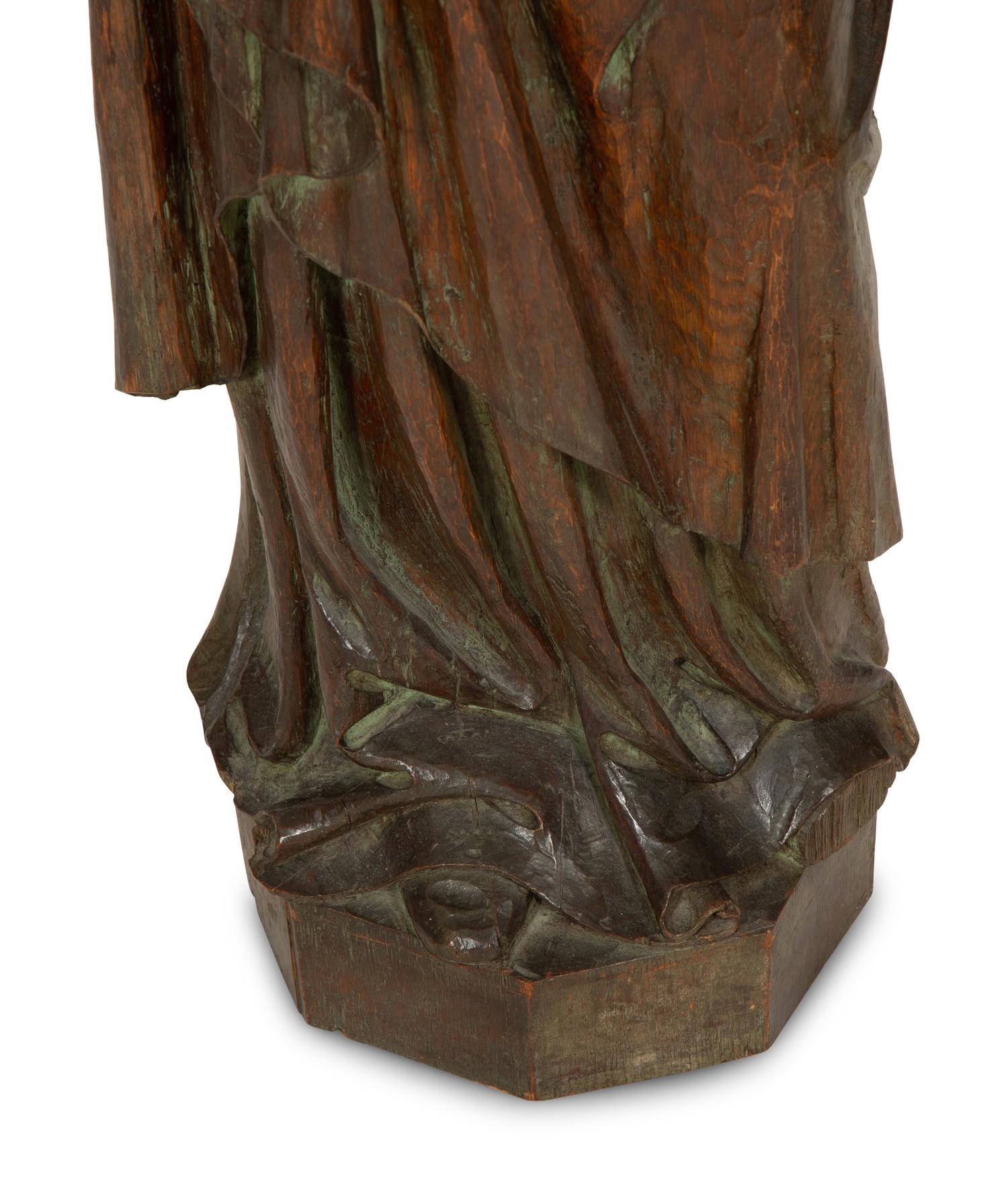 A Continental Carved Oak Figure of a Saint