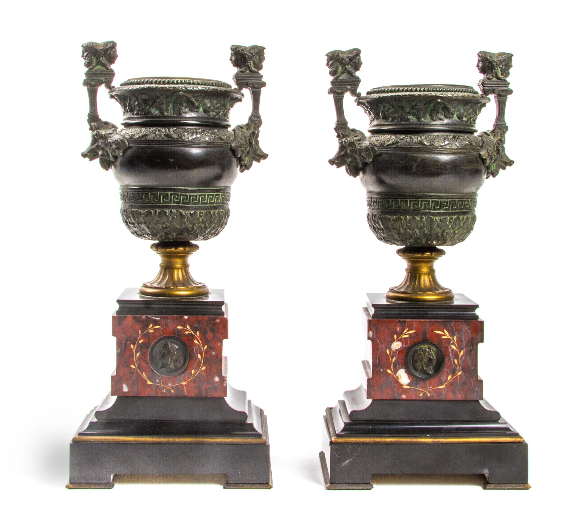 A Pair of Neoclassical Patinated Bronze and Rouge Marble Urns, Height 13 1/8 inches.