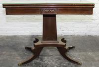 A Duncan Phyfe Style Mahogany Flip-Top Table. Height 27 1/2 x width 35 x depth 18 inches.