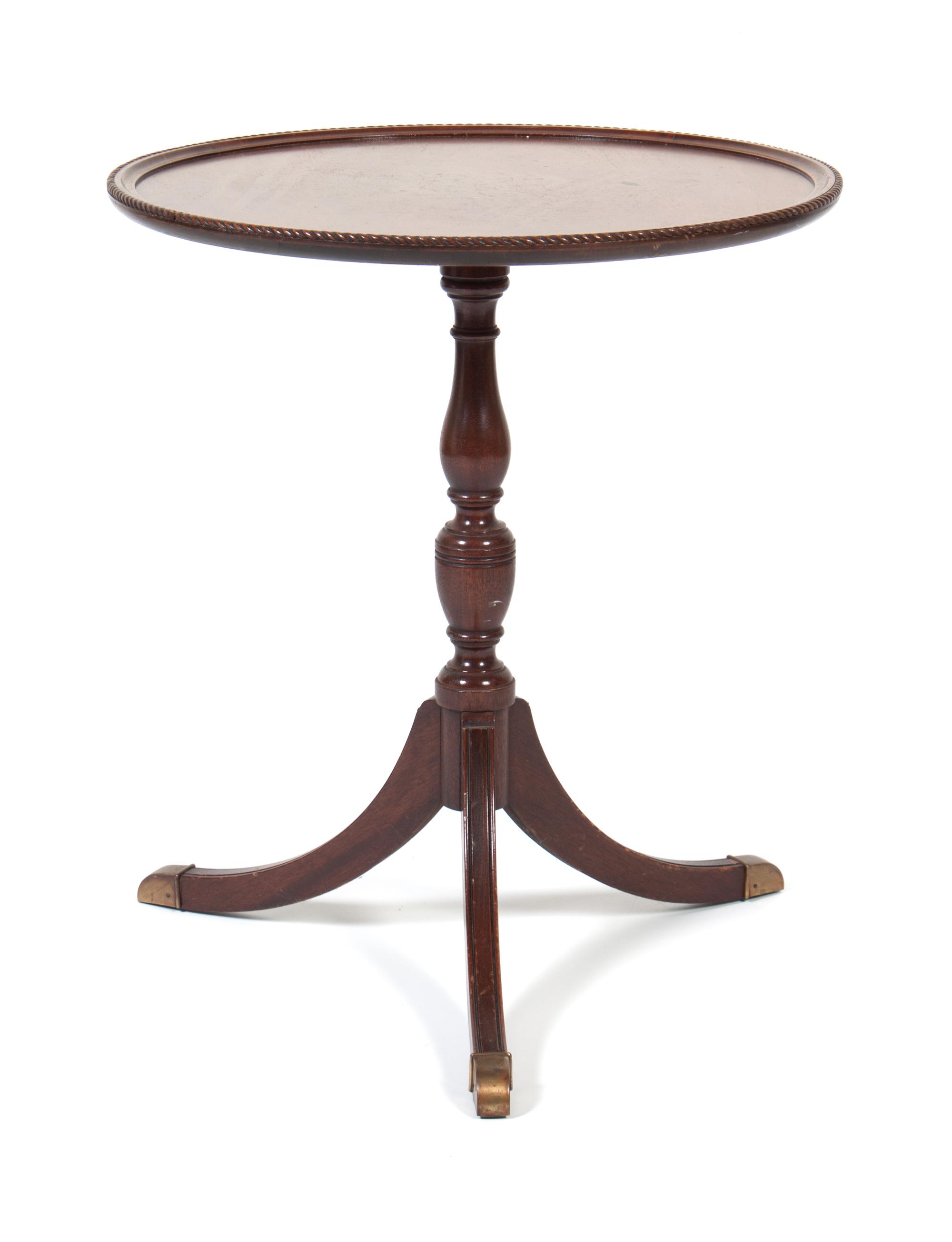 A Side Table Height 26 1/2 x diameter 23 inches.