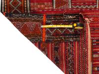 A Persian Wool Rug and Moroccan Saddle Mat