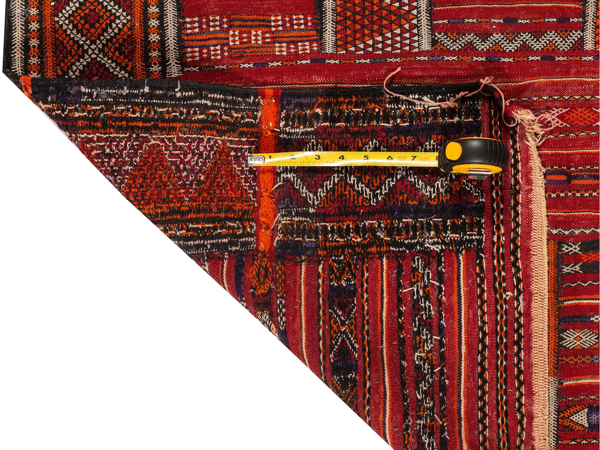 A Persian Wool Rug and Moroccan Saddle Mat