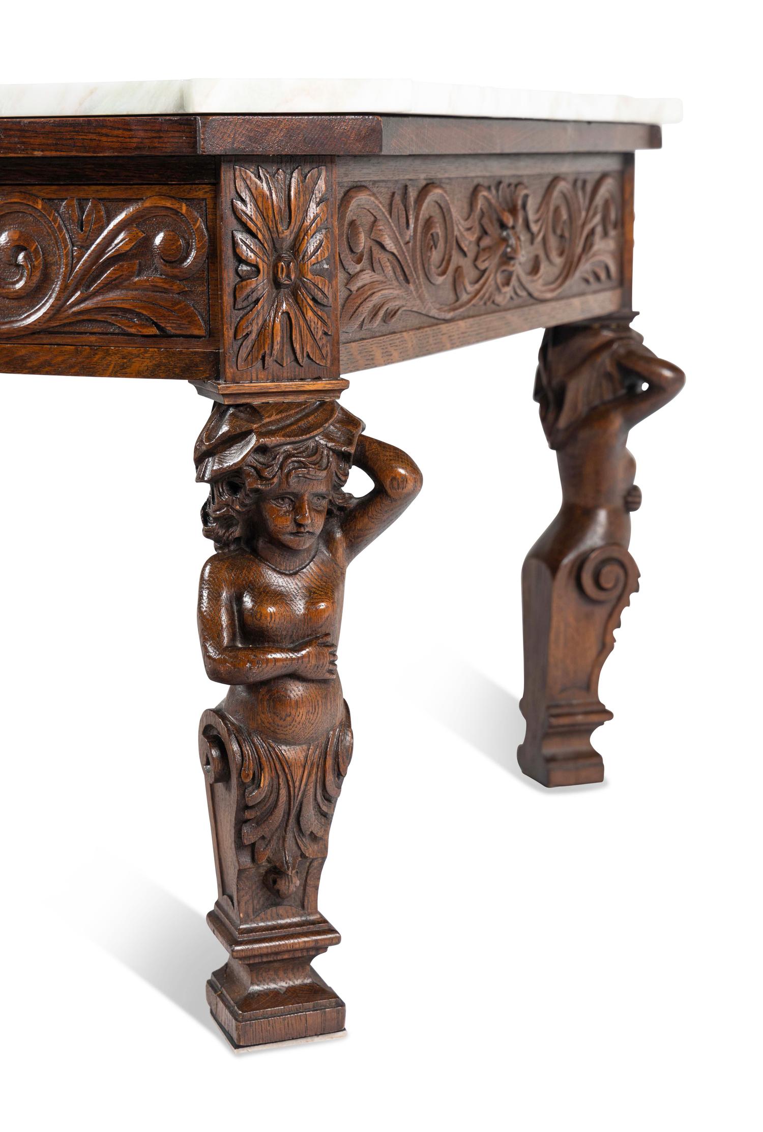 A Renaissance Style Carved Oak Marble-Top Low Table