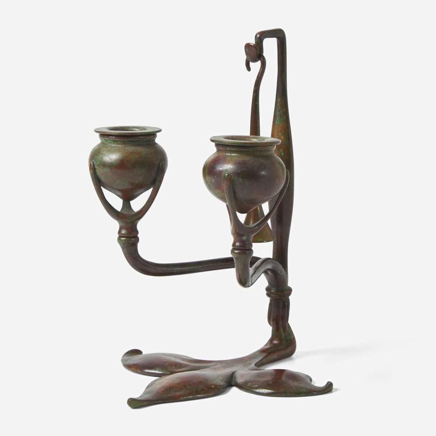 Tiffany Studios (American, active 1878-1932) A Bronze "Fleur de Lis" Two-Light Candelabra with Snuffer, USA, circa 1910