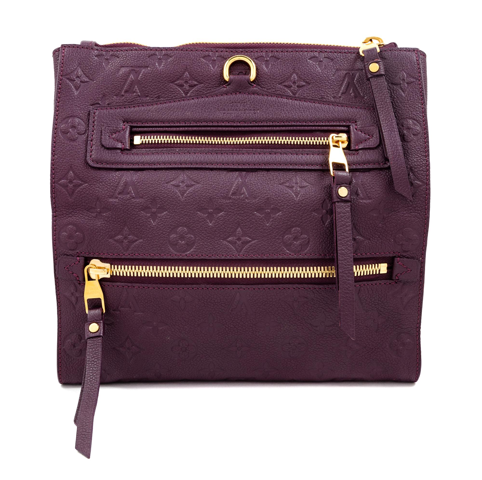 A Louis Vuitton Plum Monogram Empreinte Leather Petillante Clutch, 7" H x 10.75" W x 2.5" D.