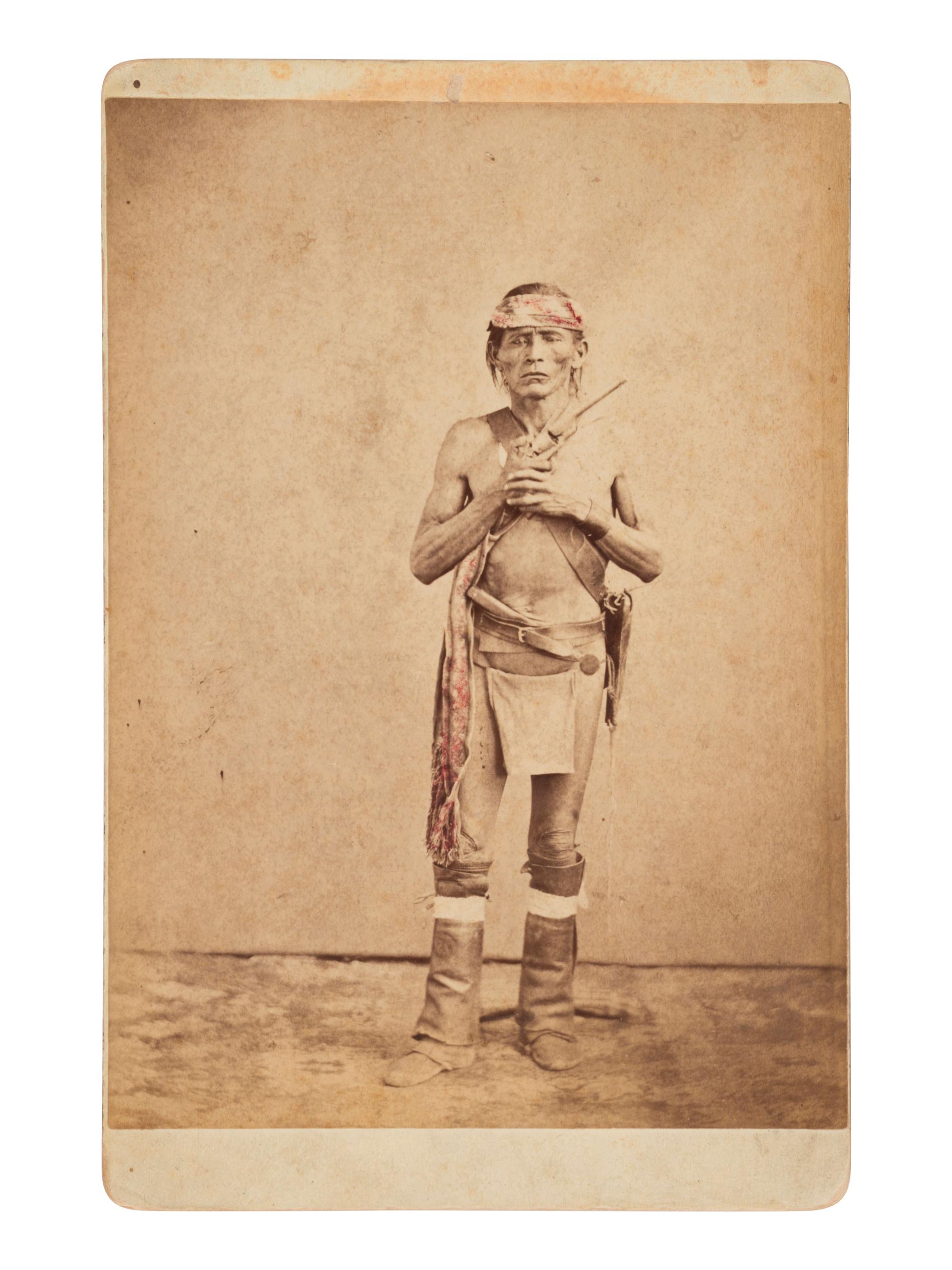 [NATIVE AMERICANS]. Cabinet card of armed Navajo scout, possibly for Gen. George Crook. Ca 1880s.