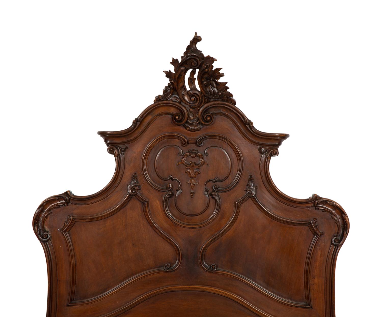 A Pair of American Victorian Carved Mahogany Twin Beds