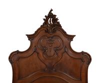 A Pair of American Victorian Carved Mahogany Twin Beds